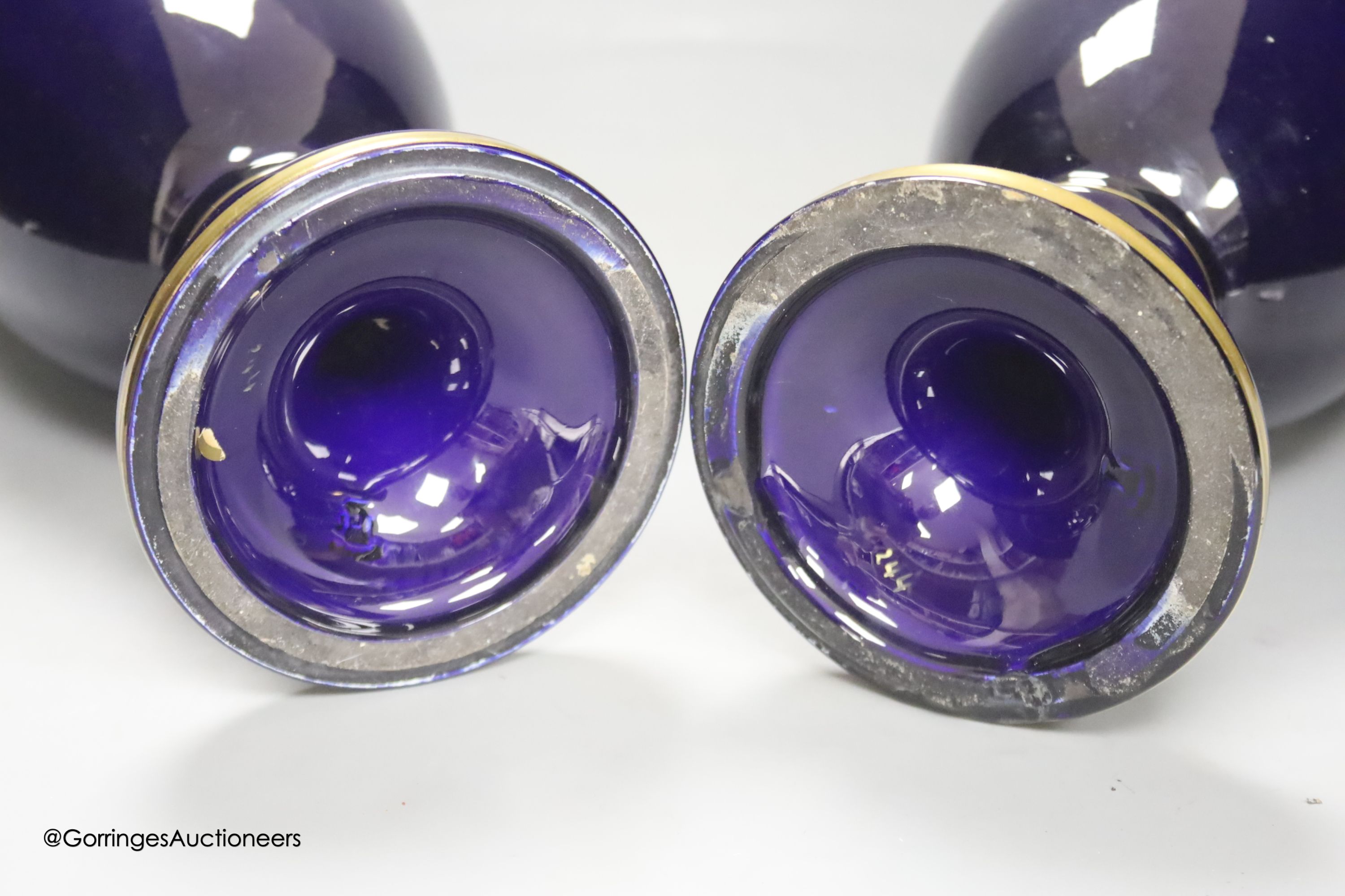 A pair of French gilt blue porcelain two handled vases, height 45cm